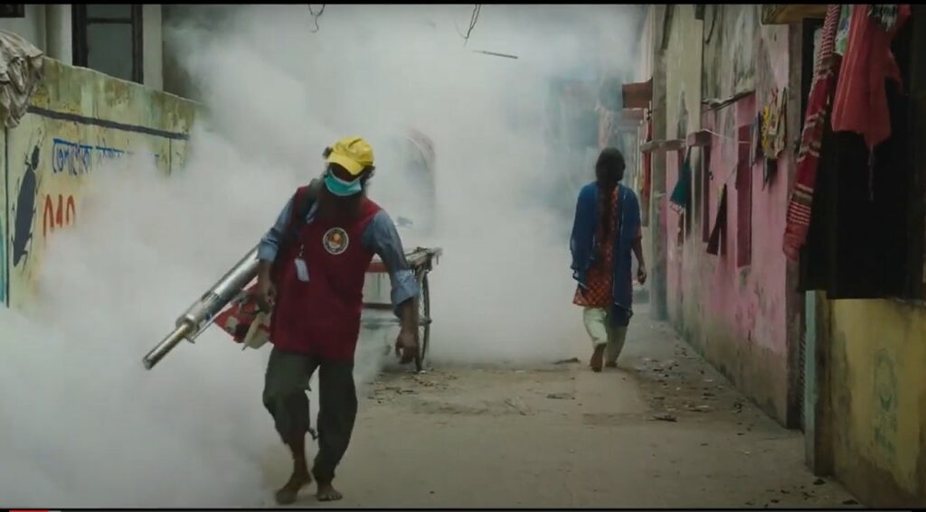 Shimu (Rikita Nandini Shimu) walks through a cloud of fumigant on the way home from work.